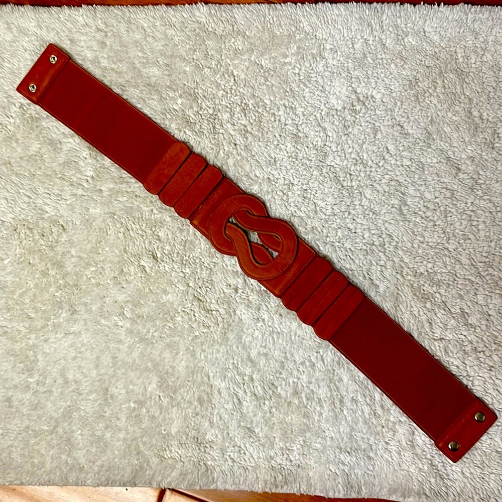 Brown elastic belt with back 2 button closure approx fits 27” waist